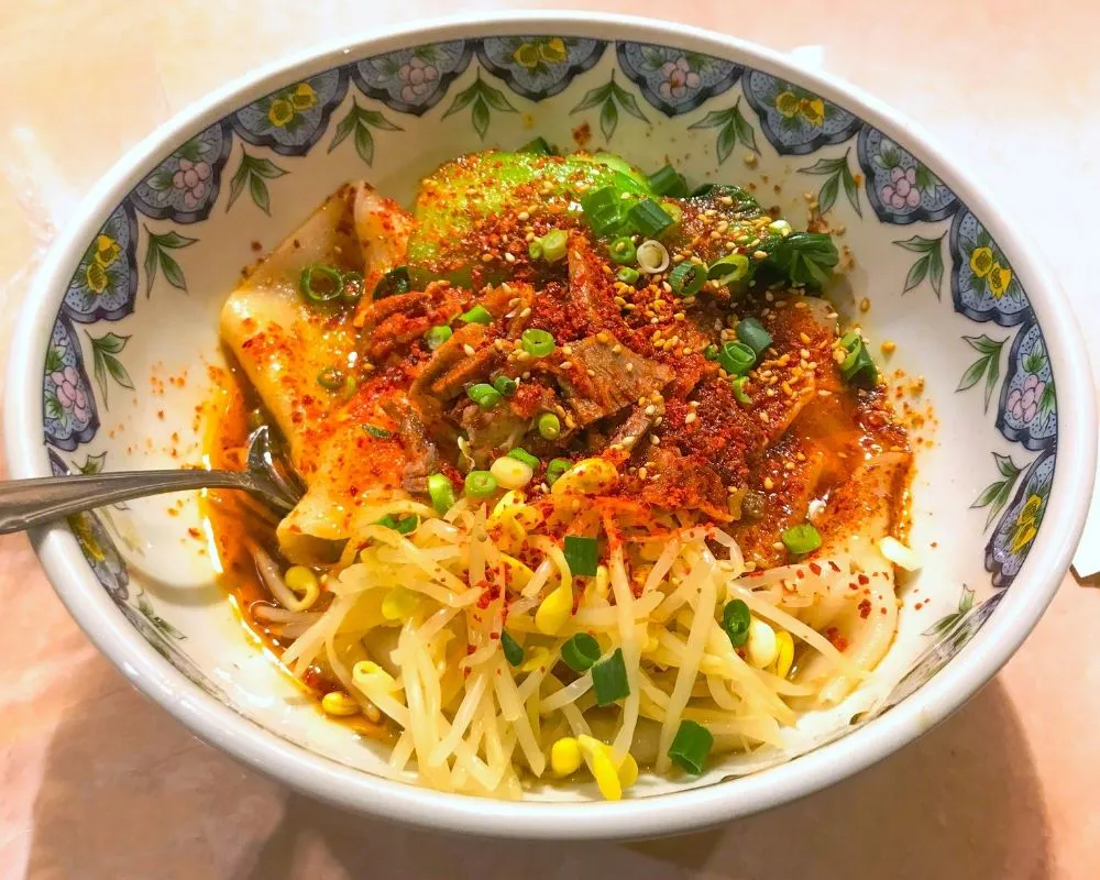 Spicy oil-poured noodles with bean sprouts at ZOEN RAMEN & POKE, Ramen Restaurant in College Station