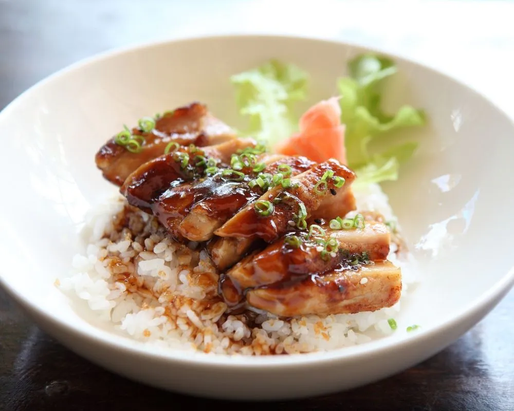 Teriyaki chicken rice bowl with scallions at ZOEN RAMEN & POKE, Ramen Restaurant in College Station